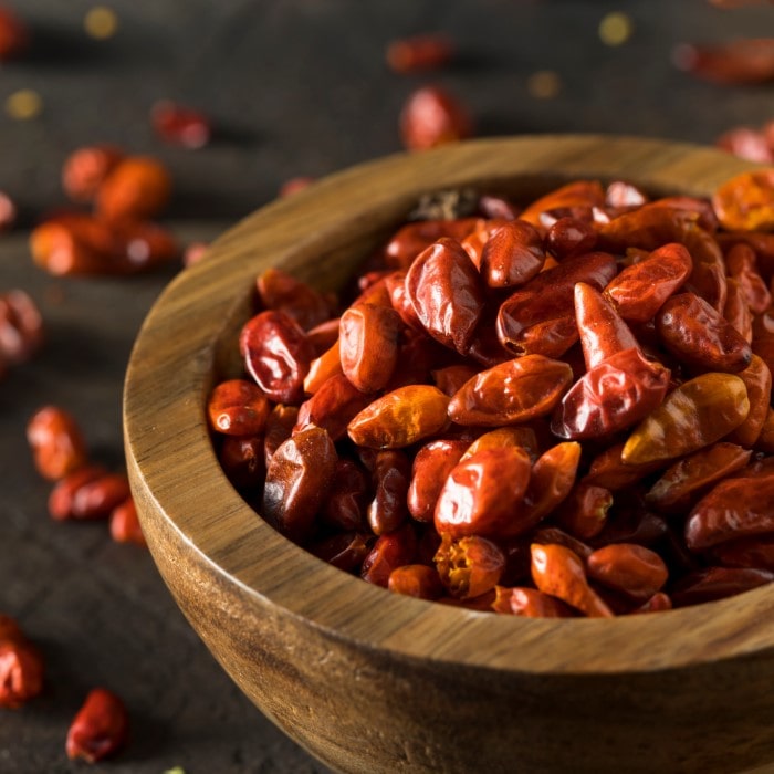 Almanac Planting Co Pequin Chili Pepper Plants. Dried fruit in a bowl.