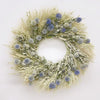 Almanac Planting Co close-up of a fresh, hand-made wreath with green wheat, avena oats, and echinops.
