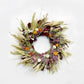 The Burgundy Statice Wreath. Made with: preserved burgundy salal, avena oats, blonde wheat, sweet annie, prosso millet, heirloom millet, rattail statice, eryngium, pearly everlasting, and strawflowers. (zoomed out image)