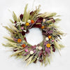 The Burgundy Statice Wreath. Made with: preserved burgundy salal, avena oats, blonde wheat, sweet annie, prosso millet, heirloom millet, rattail statice, eryngium, pearly everlasting, and strawflowers. (zoomed in image)