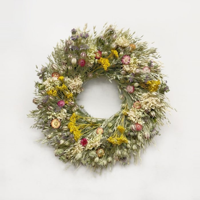The Limelight Nigella Wreath. Made with: nigella, avena oats, lemon mint, yarrow, strawflowers, and limelight hydrangea. (zoomed out view)