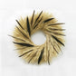 A hand made wreath made out of blonde wheat, majesty millet, and pheasant feathers.