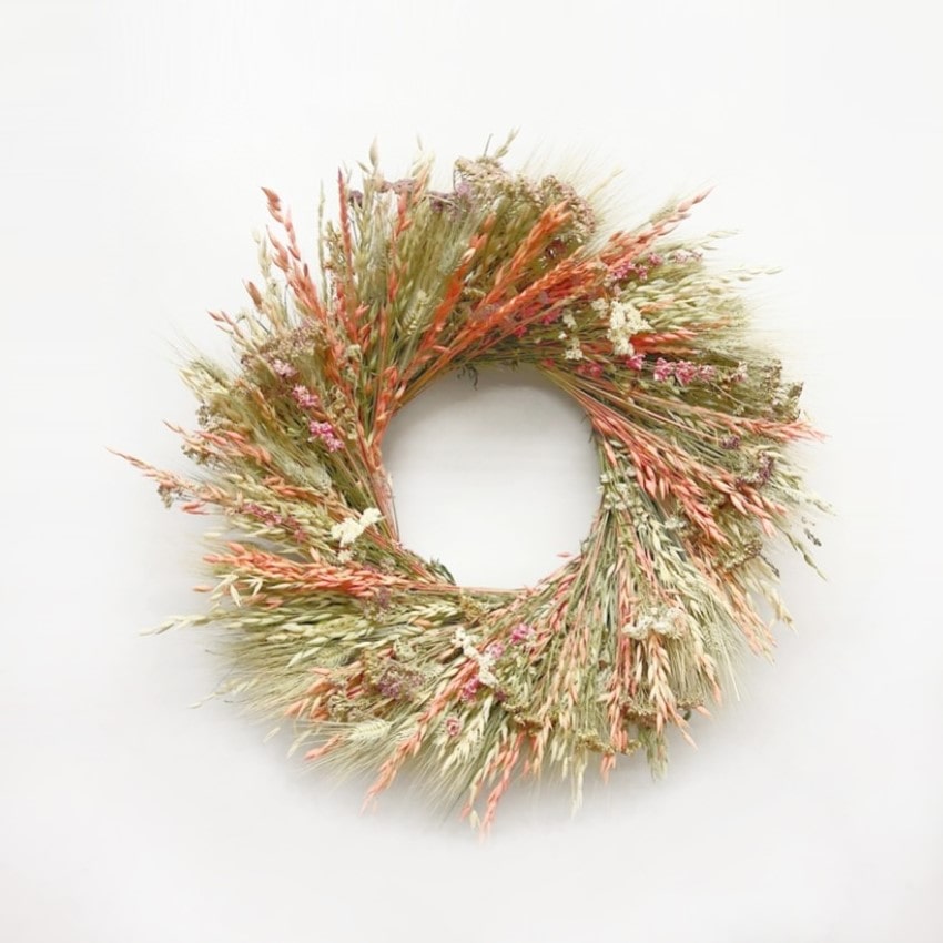 The Pearly Larkspur Wreath of avena oats, green wheat, orange colored avena oats, pink lankspur, natural color yarrow, and pearly everlasting.