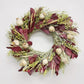 A handmade-to-order fresh wreath of avena oats, preserved burgundy salal, lupidium field pennycress, feather reed grass, poppy pods.