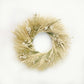 The Sinuata Wheat Wreath of blonde wheat, flax, sinuata statice, and pearly everlasting.