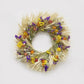 The Strawflower Amaranth Wreath. Made with: blonde wheat, sinuata statice, yarrow, ivory globe amaranth, and strawflowers. (zoomed out view)