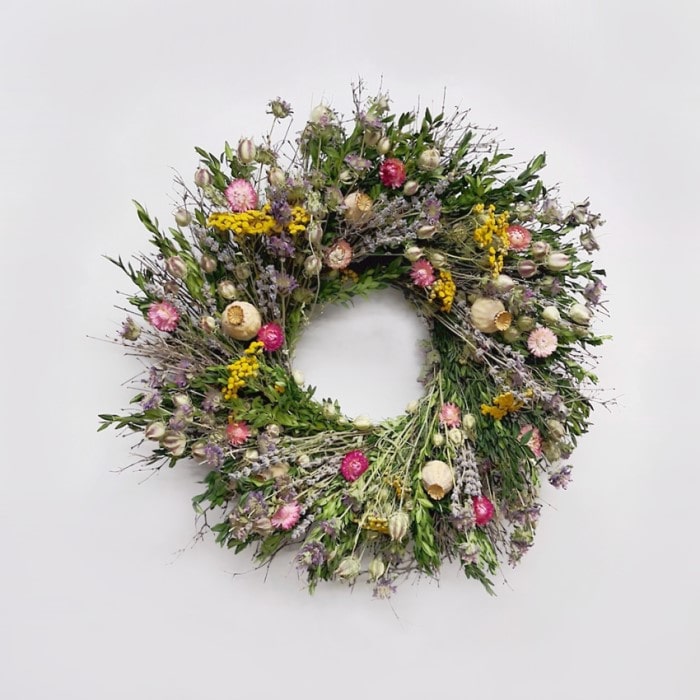The Twiggy Lavender Wreath. Made with: quail brush twigs, boxwood, lemon mint, nigella, lavender, tansy, strawflowers, and poppy pods. (zoomed out view)