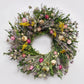 The Twiggy Lavender Wreath. Made with: quail brush twigs, boxwood, lemon mint, nigella, lavender, tansy, strawflowers, and poppy pods. (zoomed in view)